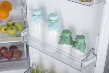 Open fridge full of fresh fruits and vegetables