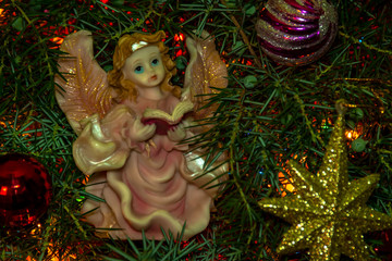 christmas angel on spruce branch
