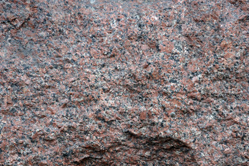 Аbstract background of granite stone surface close up.