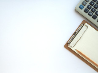 Notes clipboard with pencil, blank sheets of paper and calculator on white background,copy space, top view.