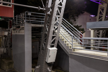 Large steel girder in front of a staircase