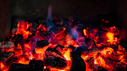 Red Hot Embers, burning with blue extremely hot flames
