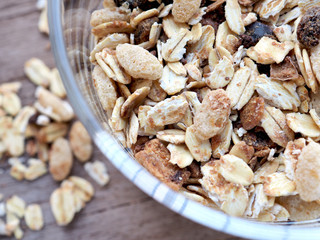 Wholegrain and Oats in glass bowl on wooden table,Close up and top view, Healthy concept.