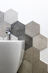 Interior of a house, private bathroom. hexagonal tiles with natural colors on gray brown in a...