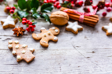Christmas spices and gingerbread cookies on vintage background.