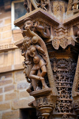 Fototapeta na wymiar Bracket design with divine dancer on the columns of Shri Mahaveer Jain temple, Jaisalmer Fort, Jaisalmer, Rajasthan, India