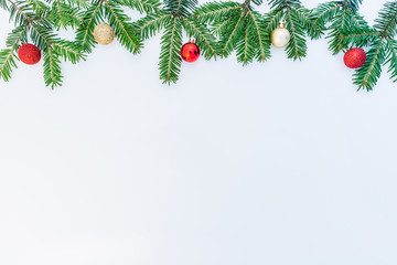 Christmas and New Year background with decorations, fir branches and space for text.
