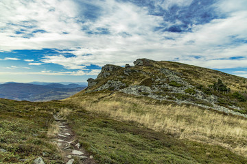 Fototapeta na wymiar rocky mountain landscape highland meadow with narrow lonely stone trail north scenery environment 