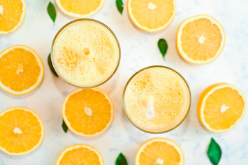 Fototapeta na wymiar Healthy food, background, halves of oranges sliced for making orange juice