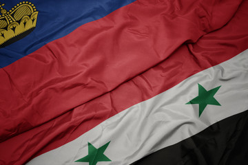 waving colorful flag of syria and national flag of liechtenstein.