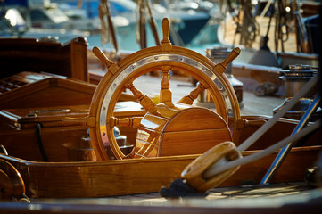 Steering wheel of a sailing yacht. Sailing and yachting - 307132678