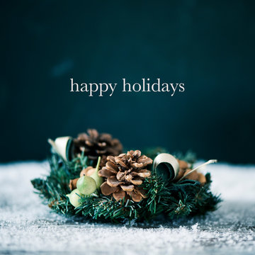 christmas wreath and text happy holidays