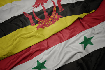 waving colorful flag of syria and national flag of brunei.