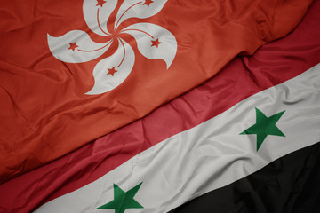 waving colorful flag of syria and national flag of hong kong.