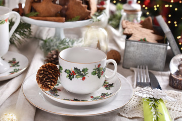 Christmas table setting with traditional porcelain tableware set