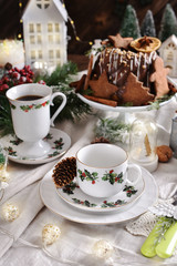 Christmas table with retro style decors and gingerbread ring cake