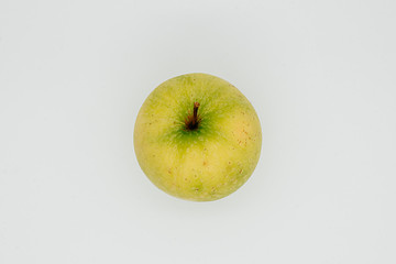 Green apple on a white background close-up