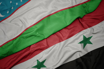 waving colorful flag of syria and national flag of uzbekistan.