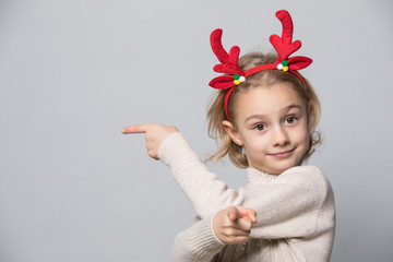 Little girl in winter look. Christmas concept.