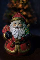 gift santa on blured tree background
