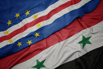 waving colorful flag of syria and national flag of cape verde.