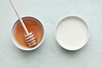Fototapeta na wymiar Honey and yogurt, ingredients for homemade natural face mask, skin treatment.
