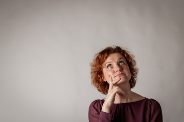Red-haired woman.
