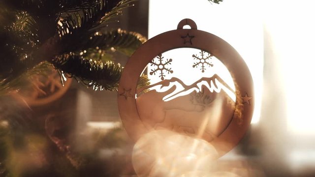 warm sunny glare through a Christmas tree toy depicting a deer