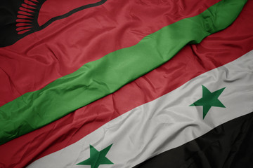 waving colorful flag of syria and national flag of malawi.