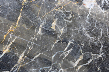 Patterned natural of dark gray marble pattern (Russia Gold) background for design.