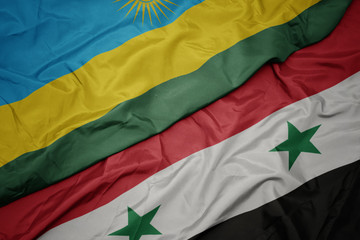waving colorful flag of syria and national flag of rwanda.