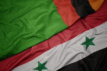 waving colorful flag of syria and national flag of zambia.