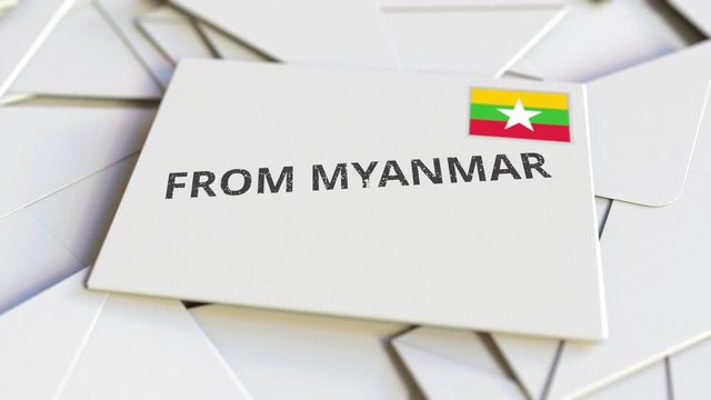 Letter with From Myanmar text on pile of other Letters. International mail related conceptual 3D animation