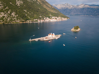 Aerial photo of St. George and monastery on the islands near Perast town in Kotor bay