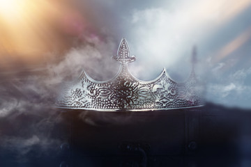 mysterious and magical photo of of beautiful queen/king crown over gothic snowy dark background. Medieval period concept
