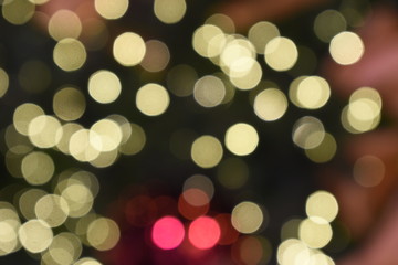 Bokeh light of golden, orange and red colorful light on nighttime, blurring background