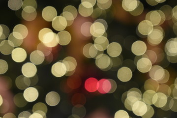 Bokeh light of golden, orange and red colorful light on nighttime, blurring background