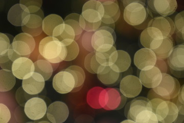 Bokeh light of golden, orange and red colorful light on nighttime, blurring background