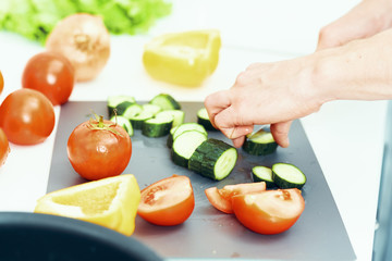 woman cutting vegetables in the kitchen