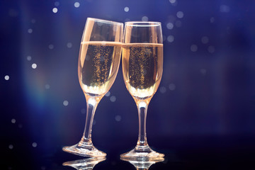 Two champagne glasses ready to bring in the New Year