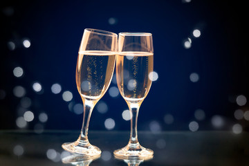 Two champagne glasses ready to bring in the New Year