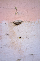cracked and peeling paint and grunge old wall with texture
