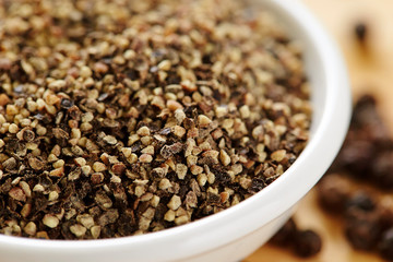 Black pepper coarse in white dish 