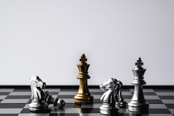 Chess King stand over the enemies. The winner in business competition. Competitiveness and strategy. Copy space.