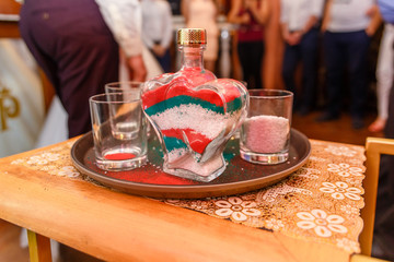 filled with colored salt by the bottle, a Russian wedding tradition