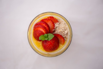 Chia pudding and mango smoothie with strawberries