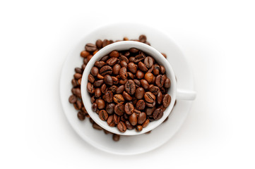 Cup of coffee with fried beans on white  background, isolate