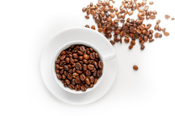 Cup of coffee with fried beans on white  background, isolate