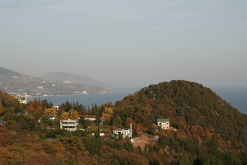 Fototapeta na wymiar village in the mountains against the sea