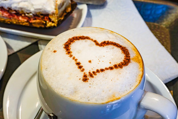 Tbilisi, Georgia Cake, espresso, and a cappucino at a coffee shop.
